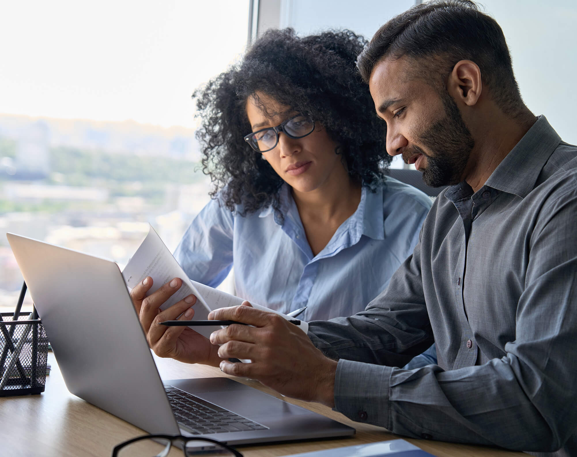 a woman and a man review paperwork